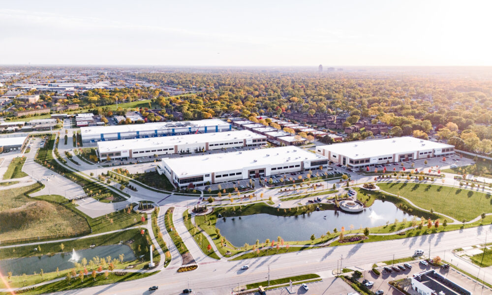 SpaceCo, aerial wide shot of facilities, water in foreground, trees in background, elk grove technology park