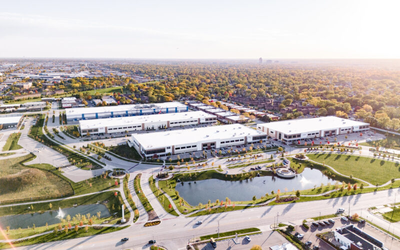 SpaceCo, aerial wide shot of facilities, water in foreground, trees in background, elk grove technology park