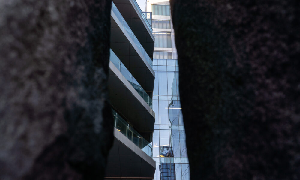 SpaceCo, sliver of google headquarters through black object on sides, vertical, google headquarters