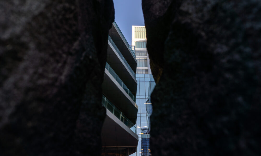 SpaceCo, sliver of google headquarters through black object on sides, horizontal, google headquarters