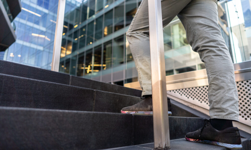 SpaceCo, clear image of person legs and shoes walking up stairs, google headquarters