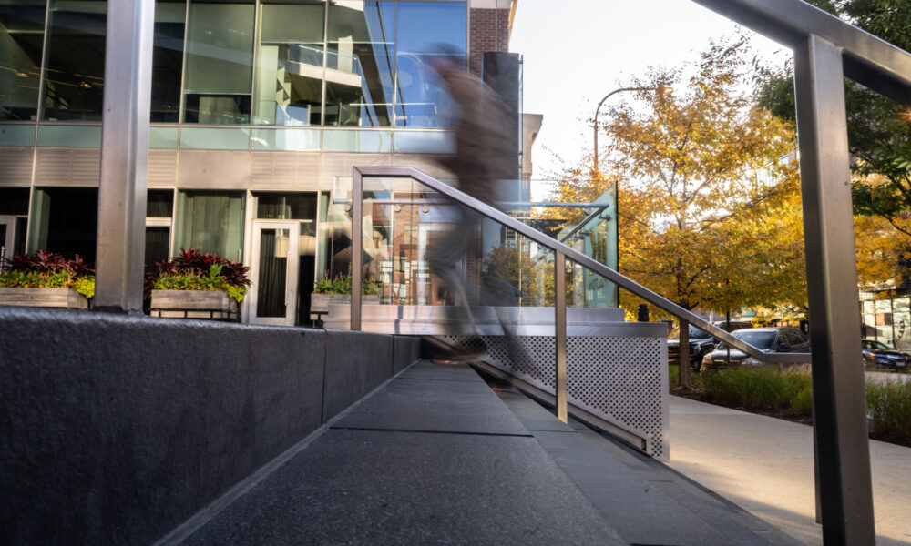 SpaceCo, sideview of blurred person walking up stairs, google headquarters