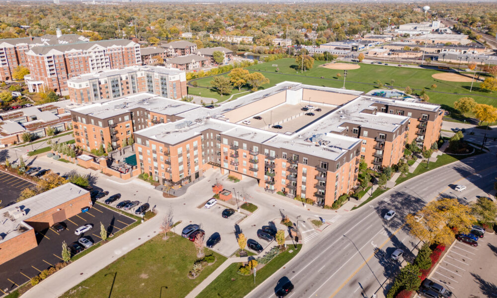 SpaceCo, aerial view of apartments, parking lot, street, skyline in background, uptown lagrange