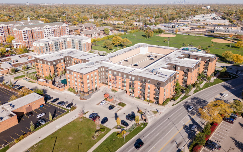 SpaceCo, aerial view of apartments, parking lot, street, skyline in background, uptown lagrange